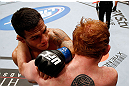 MONTREAL, QC - NOVEMBER 17:  Rafael dos Anjos (L) fights against Mark Bocek in their lightweight bout during UFC 154 on November 17, 2012  at the Bell Centre in Montreal, Canada.  (Photo by Josh Hedges/Zuffa LLC/Zuffa LLC via Getty Images)