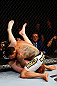 MONTREAL, QC - NOVEMBER 17:  Rafael dos Anjos (R) grapples against Mark Bocek in their lightweight bout during UFC 154 on November 17, 2012  at the Bell Centre in Montreal, Canada.  (Photo by Josh Hedges/Zuffa LLC/Zuffa LLC via Getty Images)