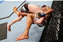 MONTREAL, QC - NOVEMBER 17:  Rafael dos Anjos gets taken down by Mark Bocek (L) during their lightweight bout during UFC 154 on November 17, 2012  at the Bell Centre in Montreal, Canada.  (Photo by Josh Hedges/Zuffa LLC/Zuffa LLC via Getty Images)