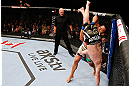 MONTREAL, QC - NOVEMBER 17:  Rafael dos Anjos takes down Mark Bocek in their lightweight bout during UFC 154 on November 17, 2012  at the Bell Centre in Montreal, Canada.  (Photo by Josh Hedges/Zuffa LLC/Zuffa LLC via Getty Images)