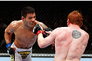 MONTREAL, QC - NOVEMBER 17:  Rafael dos Anjos (L) throws a punch against Mark Bocek in their lightweight bout during UFC 154 on November 17, 2012  at the Bell Centre in Montreal, Canada.  (Photo by Josh Hedges/Zuffa LLC/Zuffa LLC via Getty Images)