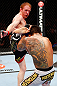 MONTREAL, QC - NOVEMBER 17:  Rafael dos Anjos (R)  blocks a kick from Mark Bocek in their lightweight bout during UFC 154 on November 17, 2012  at the Bell Centre in Montreal, Canada.  (Photo by Josh Hedges/Zuffa LLC/Zuffa LLC via Getty Images)