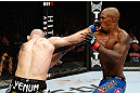 MONTREAL, QC - NOVEMBER 17:  Tom Lawlor (L) trades punches with Francis Carmont during their middleweight bout during UFC 154 on November 17, 2012  at the Bell Centre in Montreal, Canada.  (Photo by Josh Hedges/Zuffa LLC/Zuffa LLC via Getty Images)