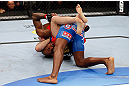 MONTREAL, QC - NOVEMBER 17:  Tom Lawlor (L) grapples against Francis Carmont during their middleweight bout during UFC 154 on November 17, 2012  at the Bell Centre in Montreal, Canada.  (Photo by Josh Hedges/Zuffa LLC/Zuffa LLC via Getty Images)