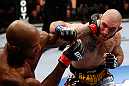 MONTREAL, QC - NOVEMBER 17:  Tom Lawlor (R) trades punches with Francis Carmont during their middleweight bout during UFC 154 on November 17, 2012  at the Bell Centre in Montreal, Canada.  (Photo by Josh Hedges/Zuffa LLC/Zuffa LLC via Getty Images)