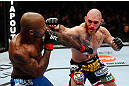 MONTREAL, QC - NOVEMBER 17:  Tom Lawlor (R) trades punches with Francis Carmont during their middleweight bout during UFC 154 on November 17, 2012  at the Bell Centre in Montreal, Canada.  (Photo by Josh Hedges/Zuffa LLC/Zuffa LLC via Getty Images)