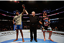 MONTREAL, QC - NOVEMBER 17:  Francis Carmont (L) reacts after defeating Tom Lawlor to win their middleweight bout during UFC 154 on November 17, 2012  at the Bell Centre in Montreal, Canada.  (Photo by Josh Hedges/Zuffa LLC/Zuffa LLC via Getty Images)