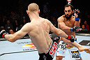 MONTREAL, QC - NOVEMBER 17:  Johny Hendricks (R) fights against Martin Kampmann in their welterweight bout during UFC 154 on November 17, 2012  at the Bell Centre in Montreal, Canada.  (Photo by Josh Hedges/Zuffa LLC/Zuffa LLC via Getty Images)