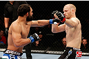 MONTREAL, QC - NOVEMBER 17:  Johny Hendricks (L) knocks out Martin Kampmann with a left hook in the first round to win their welterweight bout during UFC 154 on November 17, 2012  at the Bell Centre in Montreal, Canada.  (Photo by Josh Hedges/Zuffa LLC/Zuffa LLC via Getty Images)
