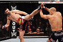 MONTREAL, QC - NOVEMBER 17:  Georges St-Pierre  blocks the kick of Carlos Condit in their welterweight title bout during UFC 154 on November 17, 2012  at the Bell Centre in Montreal, Canada.  (Photo by Josh Hedges/Zuffa LLC/Zuffa LLC via Getty Images)