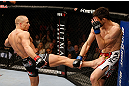 MONTREAL, QC - NOVEMBER 17:  Georges St-Pierre (L) throws a kick against Carlos Condit in their welterweight title bout during UFC 154 on November 17, 2012  at the Bell Centre in Montreal, Canada.  (Photo by Josh Hedges/Zuffa LLC/Zuffa LLC via Getty Images)