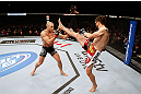 MONTREAL, QC - NOVEMBER 17:  Carlos Condit (R) attempts a kick against Georges St-Pierre in their welterweight title bout during UFC 154 on November 17, 2012  at the Bell Centre in Montreal, Canada.  (Photo by Josh Hedges/Zuffa LLC/Zuffa LLC via Getty Images)