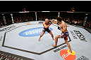 MONTREAL, QC - NOVEMBER 17:  Carlos Condit (R) lands a punch against Georges St-Pierre in their welterweight title bout during UFC 154 on November 17, 2012  at the Bell Centre in Montreal, Canada.  (Photo by Josh Hedges/Zuffa LLC/Zuffa LLC via Getty Images)