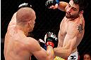 MONTREAL, QC - NOVEMBER 17:  Carlos Condit (L) fights against Georges St-Pierre in their welterweight title bout during UFC 154 on November 17, 2012  at the Bell Centre in Montreal, Canada.  (Photo by Josh Hedges/Zuffa LLC/Zuffa LLC via Getty Images)