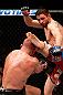 MONTREAL, QC - NOVEMBER 17:  Carlos Condit lands a left footed kick to the head of Georges St-Pierre in their welterweight title bout during UFC 154 on November 17, 2012  at the Bell Centre in Montreal, Canada.  (Photo by Josh Hedges/Zuffa LLC/Zuffa LLC via Getty Images)