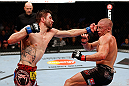 MONTREAL, QC - NOVEMBER 17:  Carlos Condit (L) lands a punch against Georges St-Pierre in their welterweight title bout during UFC 154 on November 17, 2012  at the Bell Centre in Montreal, Canada.  (Photo by Josh Hedges/Zuffa LLC/Zuffa LLC via Getty Images)