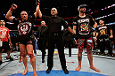 MONTREAL, QC - NOVEMBER 17:  Georges St-Pierre (L) reacts after winning his fight against Carlos Condit by a unanimous decision to retain his welterweight title during UFC 154 on November 17, 2012  at the Bell Centre in Montreal, Canada.  (Photo by Josh Hedges/Zuffa LLC/Zuffa LLC via Getty Images)