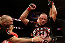 MONTREAL, QC - NOVEMBER 17:  Georges St-Pierre reacts after defeating Carlos Condit by a unanimous decision to retain his welterweight title during UFC 154 on November 17, 2012  at the Bell Centre in Montreal, Canada.  (Photo by Josh Hedges/Zuffa LLC/Zuffa LLC via Getty Images)