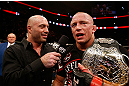 MONTREAL, QC - NOVEMBER 17:  Georges St-Pierre (R) talks with Joe Rogan after defeating Carlos Condit by a unanimous decision to retain his welterweight title during UFC 154 on November 17, 2012  at the Bell Centre in Montreal, Canada.  (Photo by Josh Hedges/Zuffa LLC/Zuffa LLC via Getty Images)