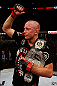 MONTREAL, QC - NOVEMBER 17:  Georges St-Pierre reacts with the belt after defeating Carlos Condit by a unanimous decision to retain his welterweight title during UFC 154 on November 17, 2012  at the Bell Centre in Montreal, Canada.  (Photo by Josh Hedges/Zuffa LLC/Zuffa LLC via Getty Images)