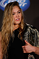 SEATTLE, WA - DECEMBER 06:  Ronda Rousey poses for photos after being presented with the UFC women's bantamweight championship during the UFC on FOX press conference on December 6, 2012 at Key Arena in Seattle, Washington.  (Photo by Josh Hedges/Zuffa LLC/Zuffa LLC via Getty Images)
