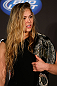 SEATTLE, WA - DECEMBER 06:  Ronda Rousey poses for photos after being presented with the UFC women's bantamweight championship during the UFC on FOX press conference on December 6, 2012 at Key Arena in Seattle, Washington.  (Photo by Josh Hedges/Zuffa LLC/Zuffa LLC via Getty Images)