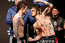 SEATTLE, WA - DECEMBER 07:  (L-R) Opponents Scott Jorgensen and John Albert face off during the official UFC on FOX weigh in on December 7, 2012 at Key Arena in Seattle, Washington.  (Photo by Josh Hedges/Zuffa LLC/Zuffa LLC via Getty Images)