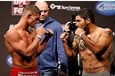 SEATTLE, WA - DECEMBER 07:  (L-R) Opponents Daron Cruickshank and Henry Martinez face off during the official UFC on FOX weigh in on December 7, 2012 at Key Arena in Seattle, Washington.  (Photo by Josh Hedges/Zuffa LLC/Zuffa LLC via Getty Images)