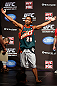SEATTLE, WA - DECEMBER 07:  Benson Henderson stands on stage wearing a Gary Payton Seattle Sonics jersey during the official UFC on FOX weigh in on December 7, 2012 at Key Arena in Seattle, Washington.  (Photo by Josh Hedges/Zuffa LLC/Zuffa LLC via Getty Images)