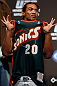 SEATTLE, WA - DECEMBER 07:  Benson Henderson stands on stage wearing a Gary Payton Seattle Sonics jersey during the official UFC on FOX weigh in on December 7, 2012 at Key Arena in Seattle, Washington.  (Photo by Josh Hedges/Zuffa LLC/Zuffa LLC via Getty Images)