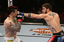 SEATTLE, WA - DECEMBER 08:  (R-L) John Albert punches Scott Jorgensen during their bantamweight bout at the UFC on FOX event on December 8, 2012  at Key Arena in Seattle, Washington.  (Photo by Ezra Shaw/Zuffa LLC/Zuffa LLC via Getty Images) *** Local Caption *** Scott Jorgensen; John Albert