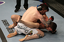 SEATTLE, WA - DECEMBER 08:  Scott Jorgensen (L) elbows John Albert (R) during their bantamweight bout at the UFC on FOX event on December 8, 2012  at Key Arena in Seattle, Washington.  (Photo by Ezra Shaw/Zuffa LLC/Zuffa LLC via Getty Images) *** Local Caption *** Scott Jorgensen; John Albert