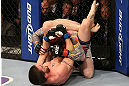 SEATTLE, WA - DECEMBER 08:  John Albert (bottom) attempts to submit Scott Jorgensen (top) during their bantamweight bout at the UFC on FOX event on December 8, 2012  at Key Arena in Seattle, Washington.  (Photo by Ezra Shaw/Zuffa LLC/Zuffa LLC via Getty Images) *** Local Caption *** Scott Jorgensen; John Albert