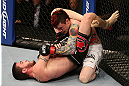 SEATTLE, WA - DECEMBER 08:  John Albert (bottom) attempts to submit Scott Jorgensen (top) during their bantamweight bout at the UFC on FOX event on December 8, 2012  at Key Arena in Seattle, Washington.  (Photo by Ezra Shaw/Zuffa LLC/Zuffa LLC via Getty Images) *** Local Caption *** Scott Jorgensen; John Albert
