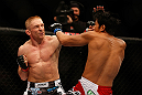 SEATTLE, WA - DECEMBER 08:  (L-R) Dennis Siver punches Nam Phan during their featherweight bout at the UFC on FOX event on December 8, 2012  at Key Arena in Seattle, Washington.  (Photo by Josh Hedges/Zuffa LLC/Zuffa LLC via Getty Images) *** Local Caption *** Dennis Siver; Nam Phan