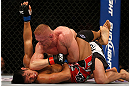 SEATTLE, WA - DECEMBER 08:  Dennis Siver (top) elbows Nam Phan (bottom)during their featherweight bout at the UFC on FOX event on December 8, 2012  at Key Arena in Seattle, Washington.  (Photo by Ezra Shaw/Zuffa LLC/Zuffa LLC via Getty Images) *** Local Caption *** Dennis Siver; Nam Phan