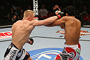 SEATTLE, WA - DECEMBER 08:  (L-R) Dennis Siver punches Nam Phan during their featherweight bout at the UFC on FOX event on December 8, 2012  at Key Arena in Seattle, Washington.  (Photo by Ezra Shaw/Zuffa LLC/Zuffa LLC via Getty Images) *** Local Caption *** Dennis Siver; Nam Phan