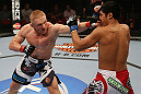 SEATTLE, WA - DECEMBER 08:  (L-R) Dennis Siver punches Nam Phan during their featherweight bout at the UFC on FOX event on December 8, 2012  at Key Arena in Seattle, Washington.  (Photo by Ezra Shaw/Zuffa LLC/Zuffa LLC via Getty Images) *** Local Caption *** Dennis Siver; Nam Phan