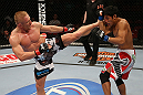 SEATTLE, WA - DECEMBER 08:  (L-) Dennis Siver kicks Nam Phan during their featherweight bout at the UFC on FOX event on December 8, 2012  at Key Arena in Seattle, Washington.  (Photo by Ezra Shaw/Zuffa LLC/Zuffa LLC via Getty Images) *** Local Caption *** Dennis Siver; Nam Phan