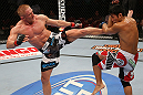 SEATTLE, WA - DECEMBER 08:  (L-R) Dennis Siver kicks Nam Phan during their featherweight bout at the UFC on FOX event on December 8, 2012  at Key Arena in Seattle, Washington.  (Photo by Ezra Shaw/Zuffa LLC/Zuffa LLC via Getty Images) *** Local Caption *** Dennis Siver; Nam Phan
