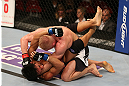 SEATTLE, WA - DECEMBER 08:  Dennis Siver (top) punches Nam Phan (bottom)during their featherweight bout at the UFC on FOX event on December 8, 2012  at Key Arena in Seattle, Washington.  (Photo by Ezra Shaw/Zuffa LLC/Zuffa LLC via Getty Images) *** Local Caption *** Dennis Siver; Nam Phan