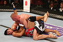 SEATTLE, WA - DECEMBER 08:  Dennis Siver (top) elbows Nam Phan (bottom)during their featherweight bout at the UFC on FOX event on December 8, 2012  at Key Arena in Seattle, Washington.  (Photo by Ezra Shaw/Zuffa LLC/Zuffa LLC via Getty Images) *** Local Caption *** Dennis Siver; Nam Phan