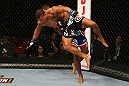 SEATTLE, WA - DECEMBER 08:  Abel Trujillo (black shorts) is lifted by Marcus LeVesseur during their lightweight bout at the UFC on FOX event on December 8, 2012  at Key Arena in Seattle, Washington.  (Photo by Ezra Shaw/Zuffa LLC/Zuffa LLC via Getty Images) *** Local Caption *** Marcus LeVesseur; Abel Trujillo
