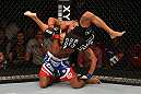 SEATTLE, WA - DECEMBER 08:  Marcus LeVesseur (red/white/blue shorts) lifts Abel Trujillo during their lightweight bout at the UFC on FOX event on December 8, 2012  at Key Arena in Seattle, Washington.  (Photo by Ezra Shaw/Zuffa LLC/Zuffa LLC via Getty Images) *** Local Caption *** Marcus LeVesseur; Abel Trujillo