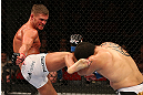 SEATTLE, WA - DECEMBER 08:  (L-R) Daron Cruickshank kicks Henry Martinez  during their lightweight bout at the UFC on FOX event on December 8, 2012  at Key Arena in Seattle, Washington.  (Photo by Ezra Shaw/Zuffa LLC/Zuffa LLC via Getty Images) *** Local Caption *** Daron Cruickshank; Henry Martinez