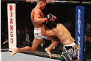 SEATTLE, WA - DECEMBER 08:  (L-R) Daron Cruickshank knees Henry Martinez  during their lightweight bout at the UFC on FOX event on December 8, 2012  at Key Arena in Seattle, Washington.  (Photo by Ezra Shaw/Zuffa LLC/Zuffa LLC via Getty Images) *** Local Caption *** Daron Cruickshank; Henry Martinez