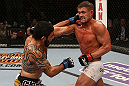 SEATTLE, WA - DECEMBER 08:  (L-R) Henry Martinez punches Daron Cruickshank during their lightweight bout at the UFC on FOX event on December 8, 2012  at Key Arena in Seattle, Washington.  (Photo by Ezra Shaw/Zuffa LLC/Zuffa LLC via Getty Images) *** Local Caption *** Daron Cruickshank; Henry Martinez