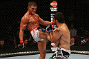SEATTLE, WA - DECEMBER 08:  (L-R) Daron Cruickshank kicks Henry Martinez during their lightweight bout at the UFC on FOX event on December 8, 2012  at Key Arena in Seattle, Washington.  (Photo by Ezra Shaw/Zuffa LLC/Zuffa LLC via Getty Images) *** Local Caption *** Daron Cruickshank; Henry Martinez