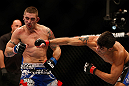 SEATTLE, WA - DECEMBER 08:  (R-L) Ramsey Nijem punches Joe Proctor during their lightweight bout at the UFC on FOX event on December 8, 2012  at Key Arena in Seattle, Washington.  (Photo by Josh Hedges/Zuffa LLC/Zuffa LLC via Getty Images) *** Local Caption *** Ramsey Nijem; Joe Proctor