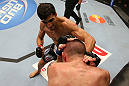 SEATTLE, WA - DECEMBER 08:  Ramsey Nijem (top) punches Joe Proctor during their lightweight bout at the UFC on FOX event on December 8, 2012  at Key Arena in Seattle, Washington.  (Photo by Ezra Shaw/Zuffa LLC/Zuffa LLC via Getty Images) *** Local Caption *** Ramsey Nijem; Joe Proctor